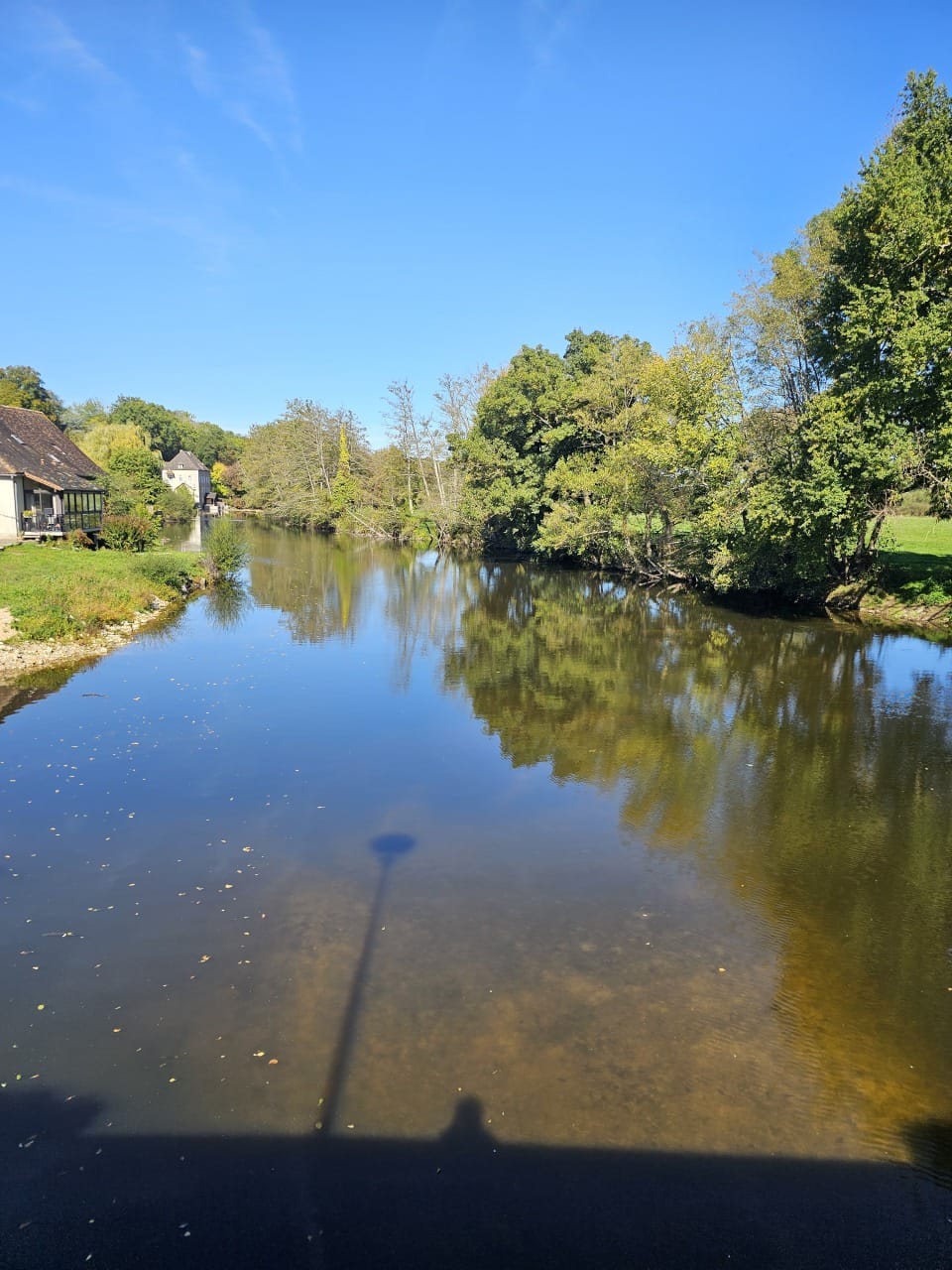 River reflection through the village